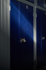 Modern blue lockers in rows in container building