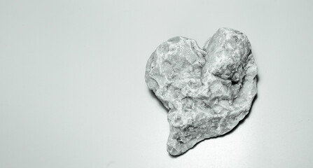 heart figure carved from stone. black White. nostalgic ambience.