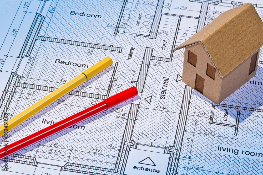 Poster building activity concept with residential building project printed on paper and building permit wit