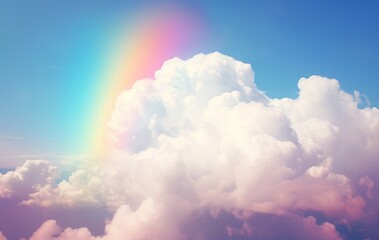 Fototapeta na wymiar A vibrant rainbow stretching across the sky with a fluffy cloud below.