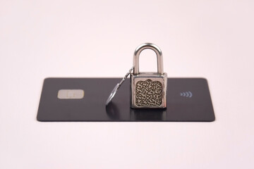 Financial fraud protection concept: credit card, padlock and master key.