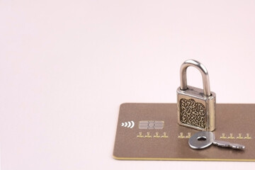 Financial fraud protection concept: credit card, padlock and master key.