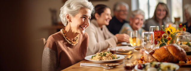 Portrait of a senior woman during Thanksgiving dinner with her family