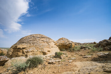 Unusual spherical shape of stones in the Kazakh steppe Mangistau, valley of balls in nature Torysh