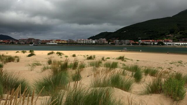 Panoramic view of Santo&ntilde;a from Puntal de Laredo with dunes in the sand of the beach and vegetation. Cantabria, Spain