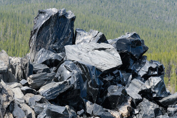 Natural obsidian volcanic glass rock pile at Newberry Volcano in Oregon