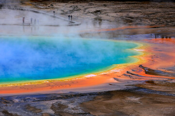 Grand Prismatic Spring with Steam in Yellowstone National Park on Rainy Day with People on the...