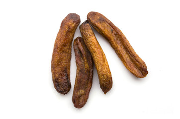 dried banana pieces on white background