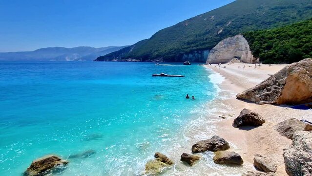 4K Video of Fteris Deserted Beach in Kefalonia. Tropical Turquoise Sea with White Pebbles.  Coastline in Ionian Islands Greece with Ambient Sea Sound. Summer Travel Destination. Cephalonia Footage.
