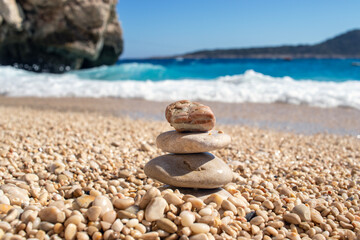natural stones on top of each other. against sea view. zen and meditation.