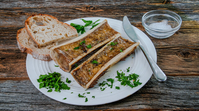 Roasted marrow bones on plate from above