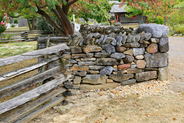 Split rail fence and stack stone wall.