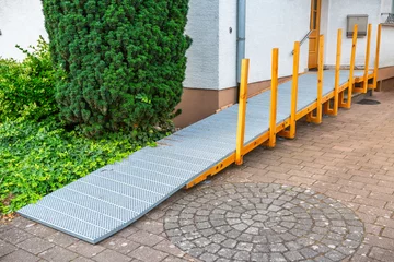 Fotobehang Wheelchair ramp fitted to front of  family house, barrier-free zone © Brebca