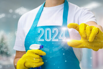 Cleaning lady shows the new year 2024.