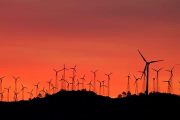 Keuken foto achterwand Mountain Wind Turbines at Dawn: Majestic Red Sunset Landscape in 4K © Only 4K Ultra HD