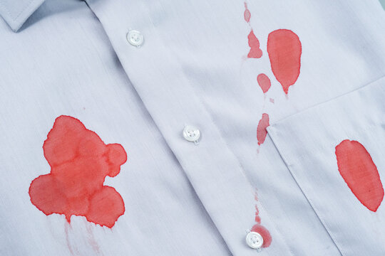 Blood staines in a gray shirt. daily life stain concept. top view. 