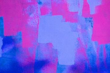 Messy paint strokes and smudges on an old painted wall. Pink, purple, blue color drips, flows,...