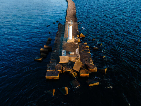 Aerial drone view of a breakwater and a lighthouse in Riga, Latvia