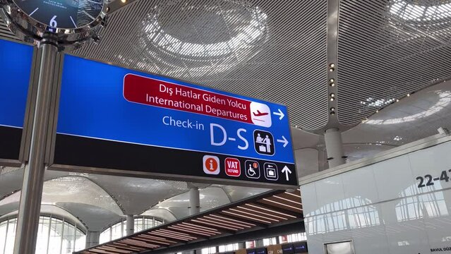 Directional arrow showing international departure flights and passport control area in Istanbul Airport