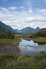 Beautiful Panoramic View of Mountains and Lake on a Sunny Summer Day