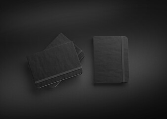 3D illustration. Notebook moleskine isolated on the black background