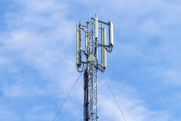 Telecommunication tower with blue sky background. Technology and communication