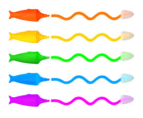 Five multicolored fish shaped magic markers drawing wavy lines