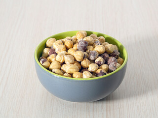 A bowl of roasted hazelnuts