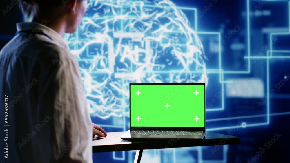 Fototapete Proficient worker using green screen laptop to implement artificial intelligence parallel processing. Tech support man works on chroma key device enabling AI systems to do machine learning inference