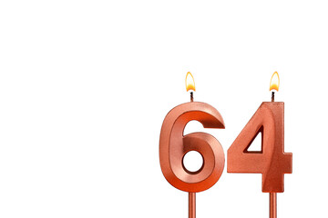 Birthday candle number 64 on white background