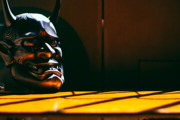 Traditional Japanese mask of a demon, Kabuki Mask on black background