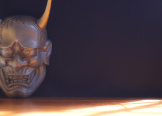 Traditional Japanese mask of a demon, Kabuki Mask on black background