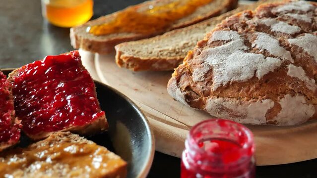 Honey and fresh bread. Sweet breakfast.Traditional food for breakfast. 4k footage