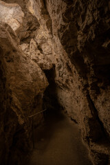 Paved Pathyway Disappears into Rock Archway in Carlsbad Caverns