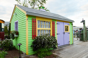 Cute colourful small wooden cabin on seaside wharf, Bar Harbor, Maine, USA