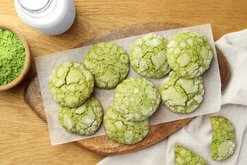 Tasty matcha cookies on wooden table, flat lay