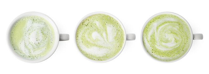 Set with cups of matcha latte isolated on white, top view