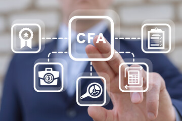 Man using virtual touch interface presses acronym: CFA. CFA Chartered Financial Analyst business...