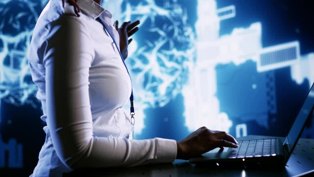 Tech support employee writing artificial intelligence script code in startup workspace on laptop terminal. Efficient IT executive doing maintenance work in high tech facility updating AI systems