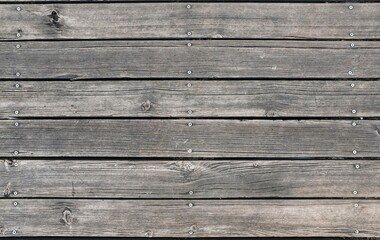 Vintage Wooden Texture: Weathered floorboards create a rustic backdrop with dark hues, evoking an aged