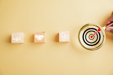 Magnifying glass zooms in on target icon, symbolizing intersection of start-up, creative ideas, and...