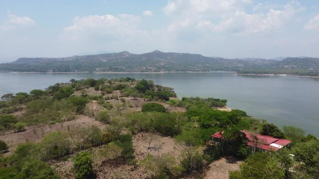 Rugged mountain shoreline of Cerron Grande Reservoir lake, El Salvador