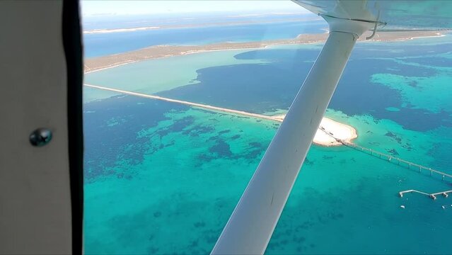 Single engine aircraft aerial view of Shark Bay and the salt mine jetty Western Australia