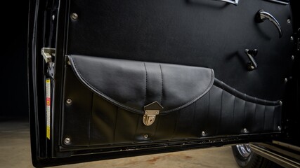 Storage compartment on a car door