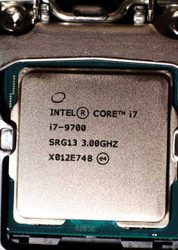 MOSCOW, RUSSIA-March 3, 2021: An 8-core high-performance PC processor is inserted into the motherboard. Top view and close-up. Dimmed lights