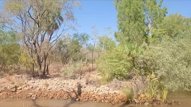 Driving through low level river in outback Western Australia
