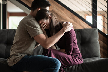 Husband comforting sad depressed unhappy wife. Helping a friend in need, family problems mental...