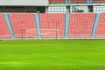 Stadium, football field, running track, seating for watching athletes