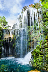 Obraz premium Small waterfall in shady garden of Chiang Mai province