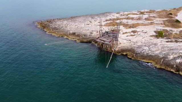 Traditional old Fisher House Trabucco at an italian sea coast